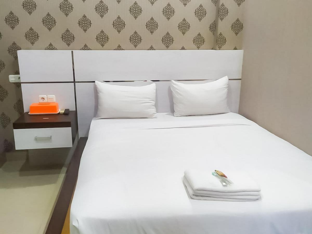 Hotel Reddoorz Syariah Near Sultan Syarif Kasim II Airport Pekanbaru Exterior foto